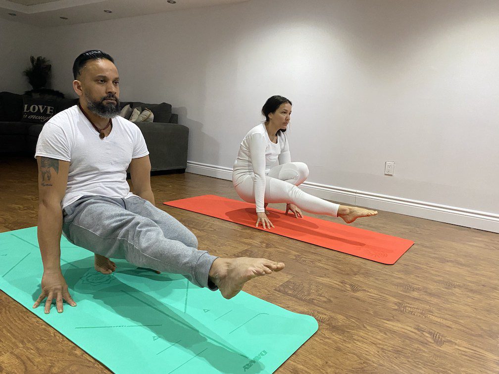A couple practising yoga together
