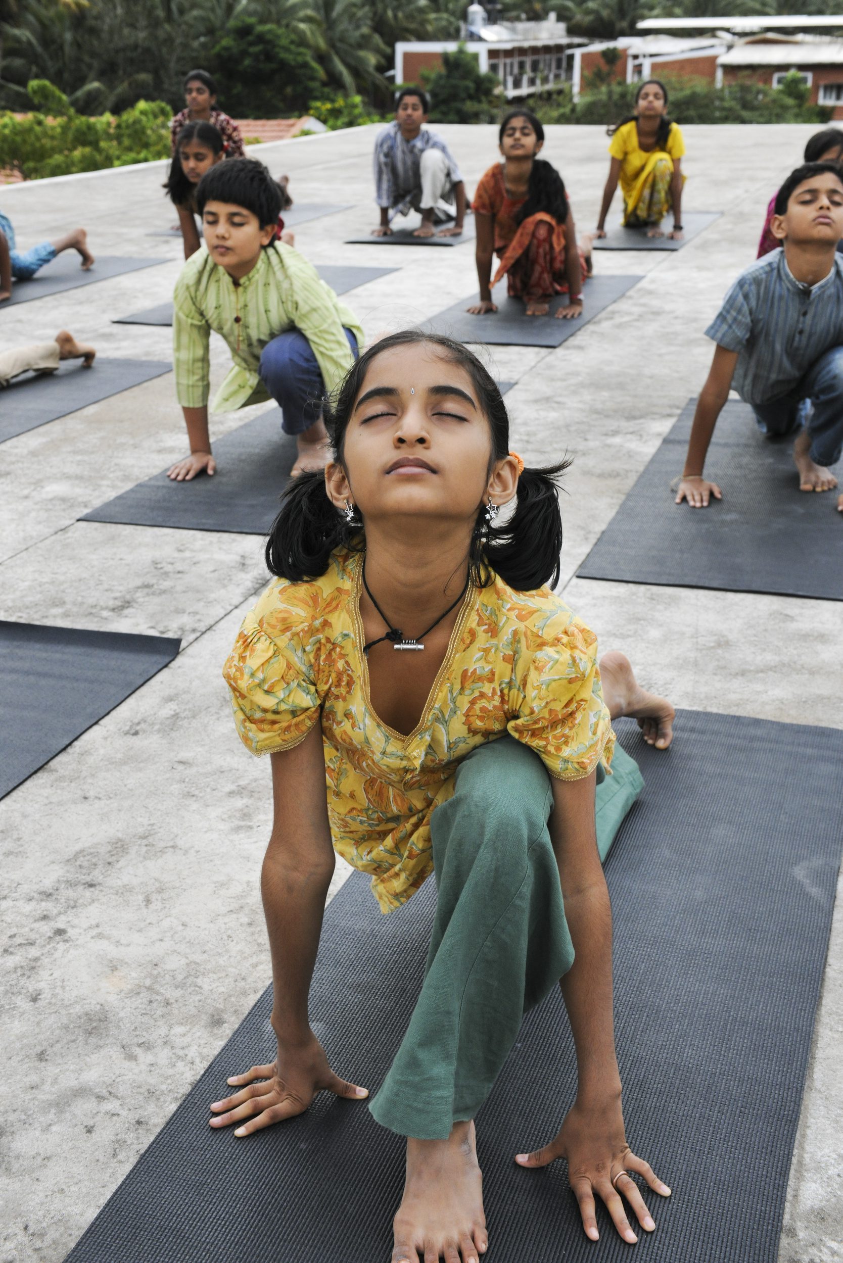 Group of kids doing Surya Shakti ( a yogic practice)
