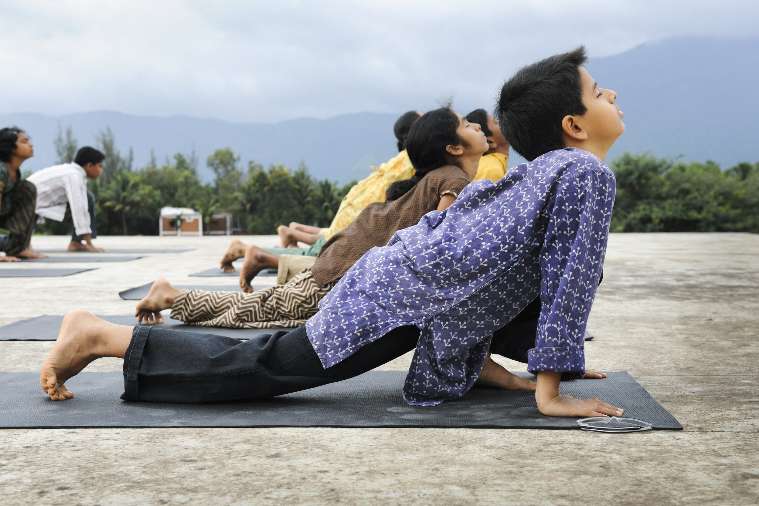 kids doing Surya Shakti : a dynamic form of sun salutation