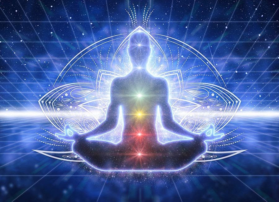 A person meditating and radiating light